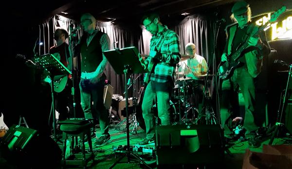 Portway Blues Band are Mark on vocals and harmonica, Andy on guitar and vocals, Tim on guitar, Paul on drums and Pete on bass and vocals